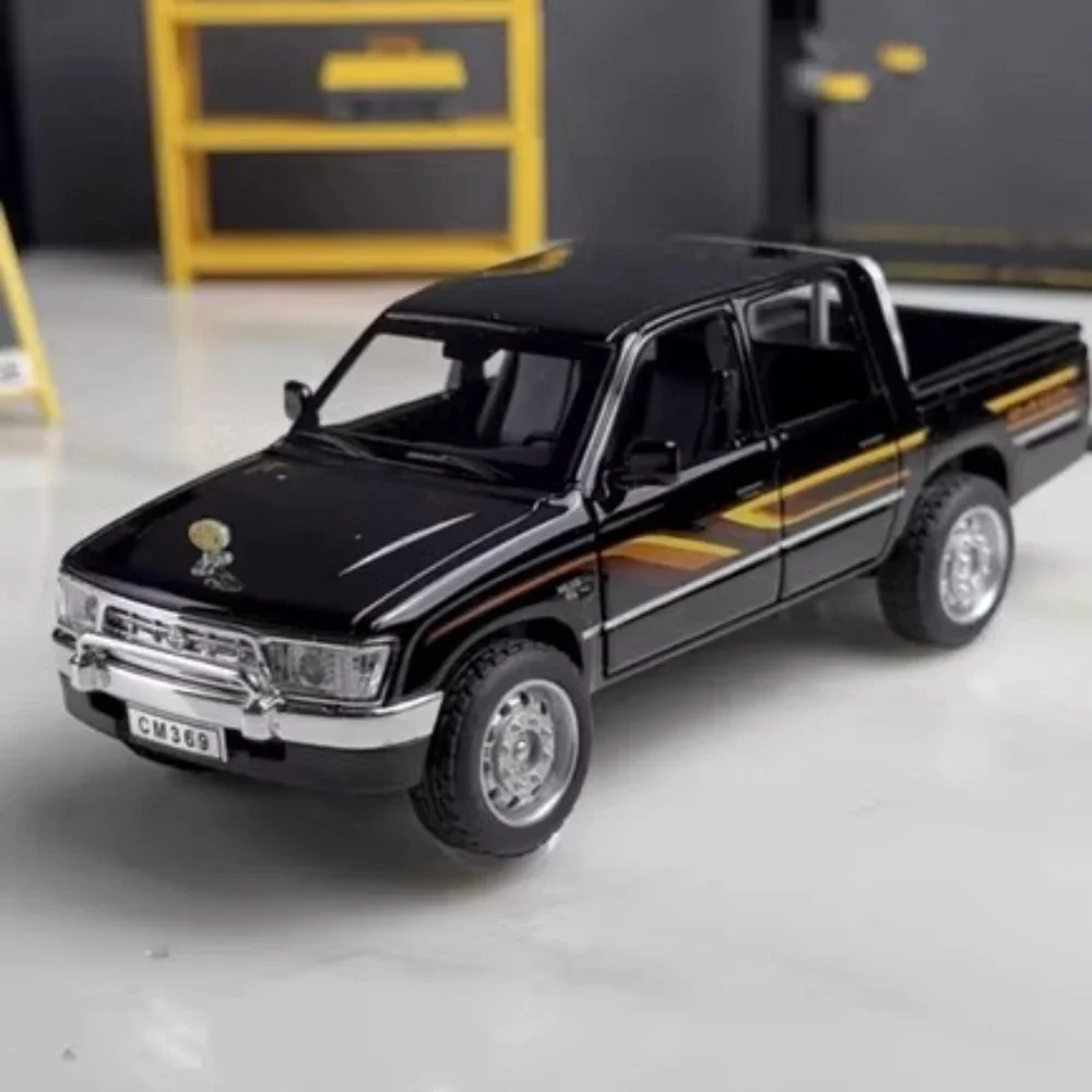 รถของเล่นโมเดล HILUX RAM MAMMOTH รุ่น 1:32 ผลิตจากโลหะผสม พร้อมเสียงและไฟ มีระบบดึงหลัง ระบบกันสะเทือน รถกระบะออฟโรด ของขวัญสำหรับเด็กผู้ชาย