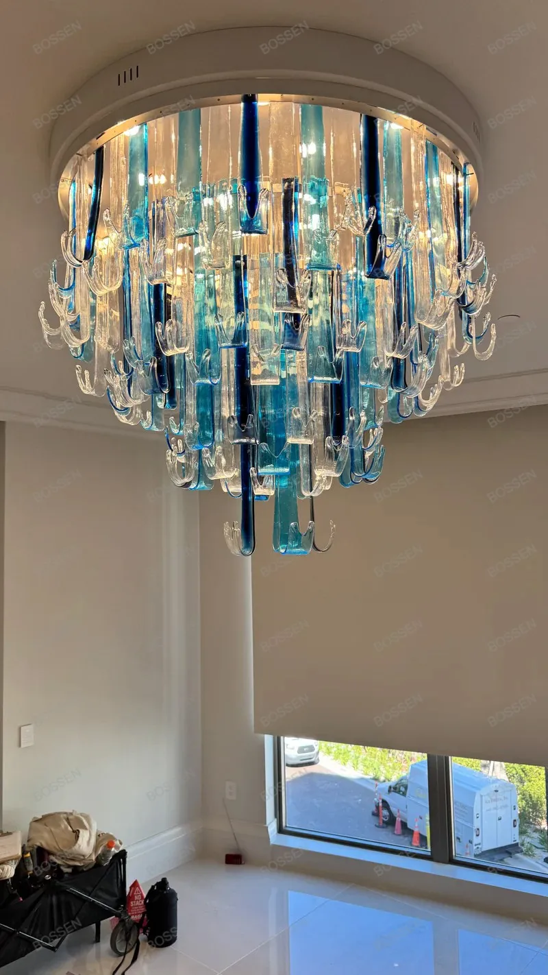 

REVEN Minimalist Waterfall Blue Glass Pendant Lamp 2026 Modern Luster Ceiling Chandelier Dimmable Fixtures for Living Room