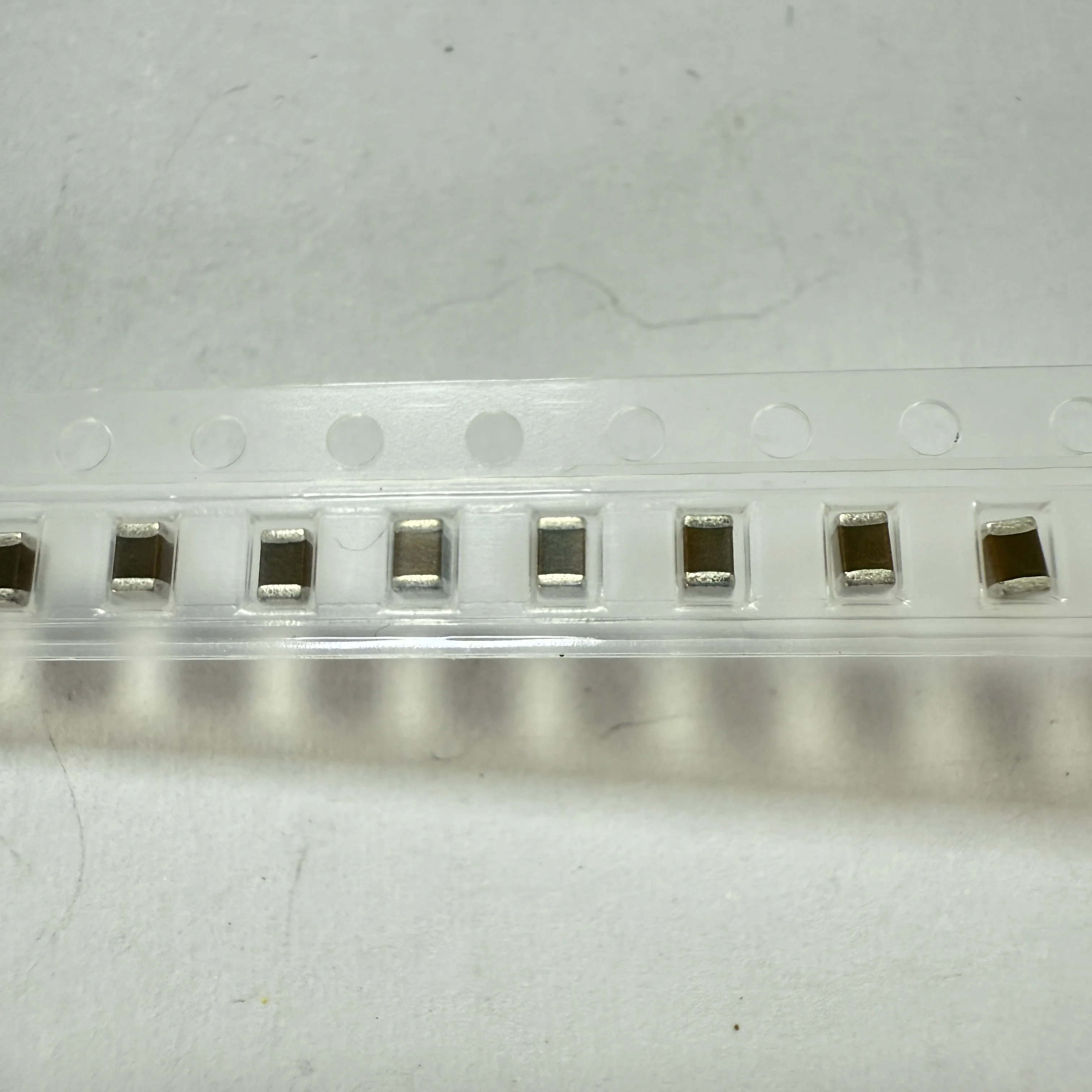 

50PCS/LOT GRM21BR61A476ME15L (Chip capacitors)