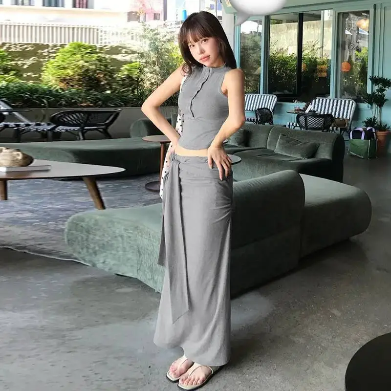 

Корейский элегантный тонкий сексуальный топ без рукавов с полуоткрытым воротником + юбка из двух предметов, комплект для женщин, модные сексуальные женские топы 02SM