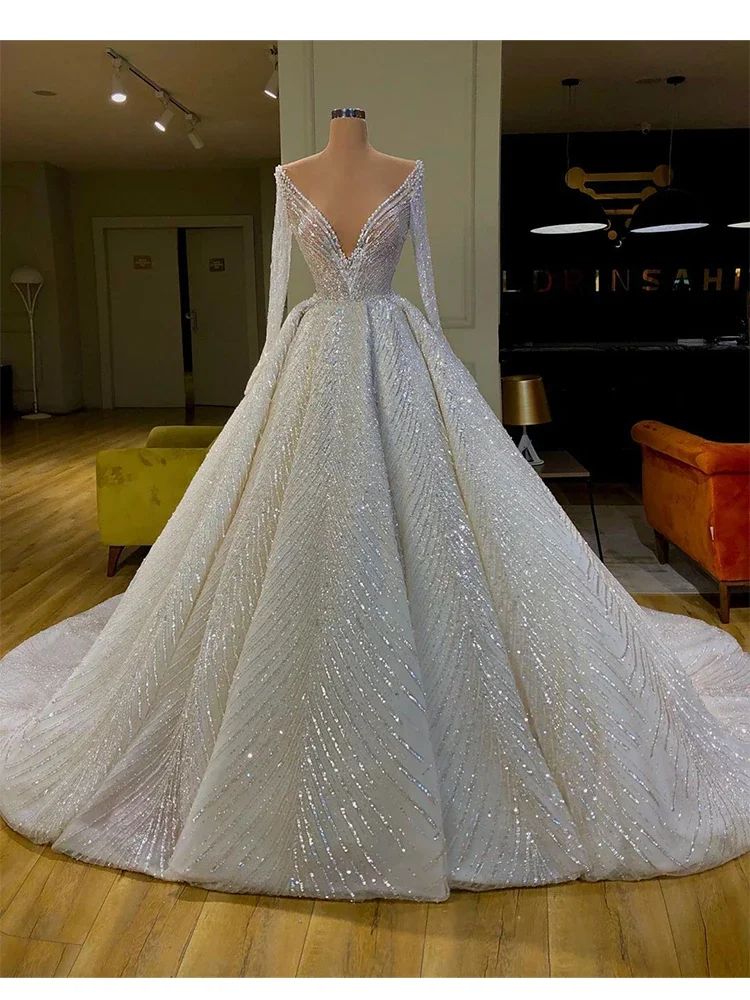 

2024 Luxury Sequins Ball Gown Wedding Dresses Long Sleeves Sheer O-neck Beaded Princess Bridal Gowns Vestido Fiesta Noche Custom