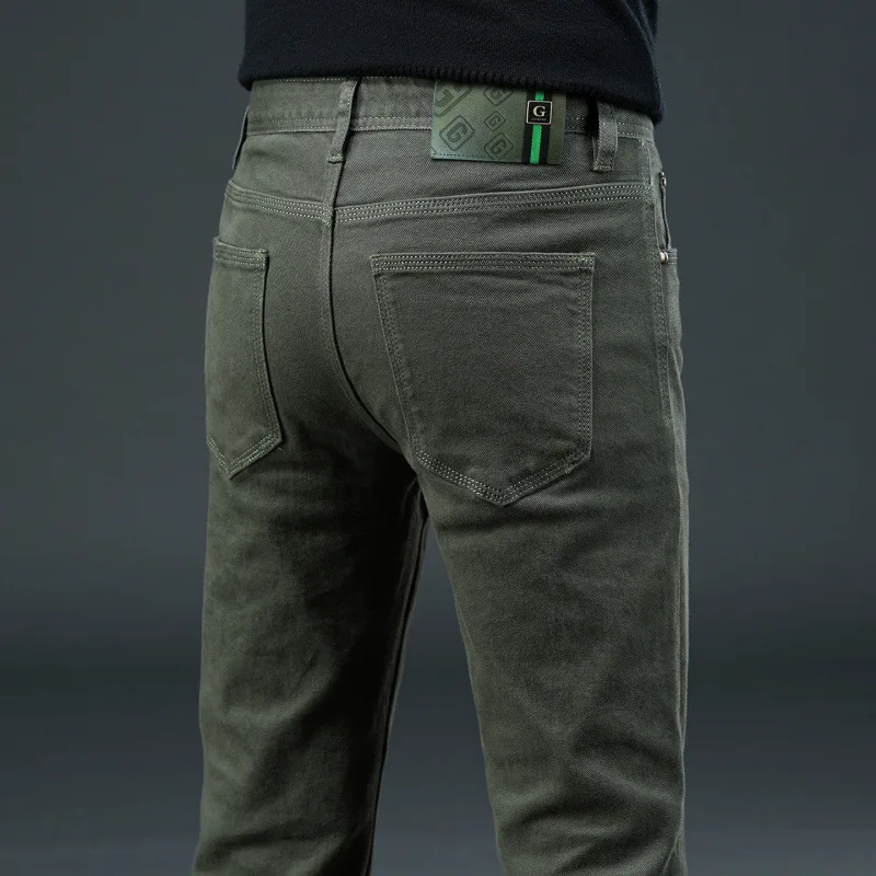 Vaqueros sencillos y lujosos para hombre en otoño de 2025, con ajuste elástico y pantalones casuales de negocios urbanos de alta gama