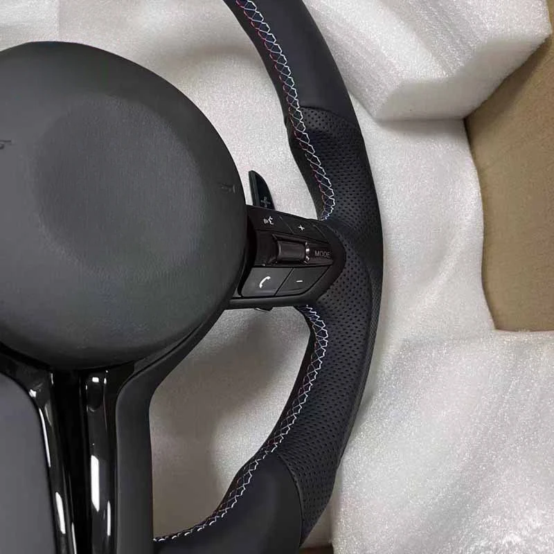 Suitable for BMAM3M5 flat-bottom sports-style leather steering wheel assembly, featuring M buttons and a red center cap, a r