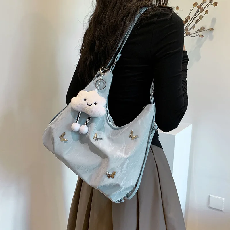 

2025 Новая женская сумка большой вместимости, многофункциональная для поездок на работу, можно использовать в качестве рюкзака, сумки через плечо или сумки через плечо.