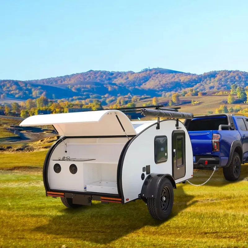 Small off-road camper trailer with independent suspension with electric brakes for camping and tent kitchens