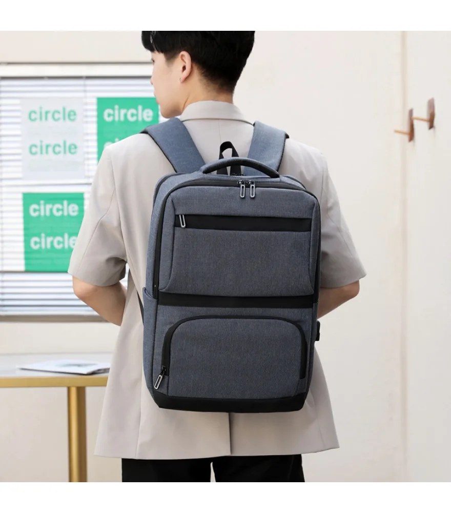 

Dark gray linen backpack with black bottom trim dual front separate pockets side external USB port anti scratch for office