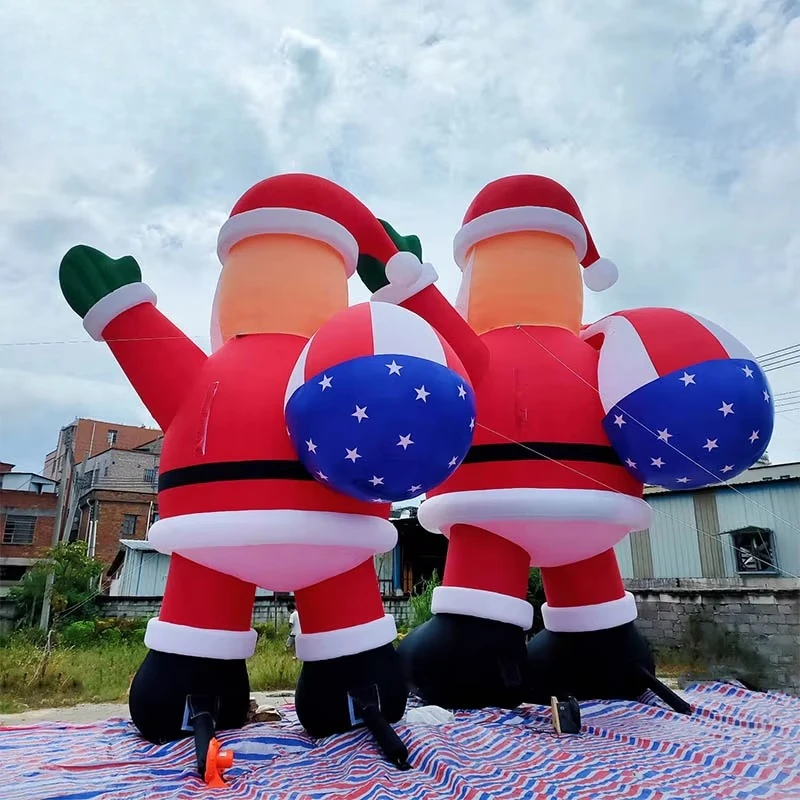 2025 زينة عيد الميلاد العملاقة القابلة للنفخ سانتا كلوز مع حزمة العلم الأمريكي الكرتون عيد الميلاد عطلة حديقة الديكور