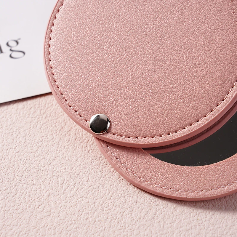 PU-leer Ultradunne ronde make-upspiegel Roestvrij staal Dubbelzijdige cosmetische spiegel Opvouwbare zak Compacte spiegel voor op reis