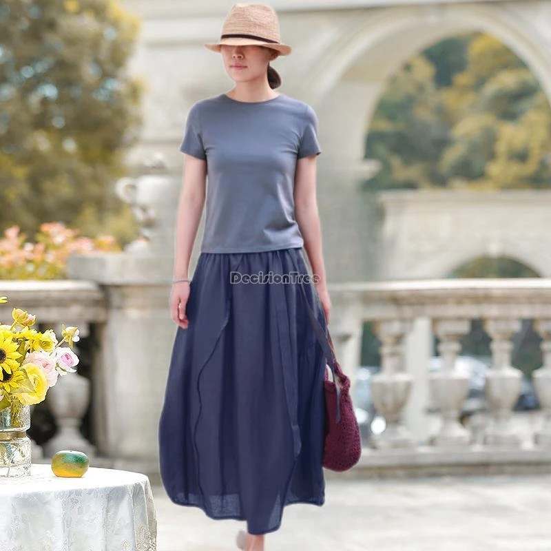 تنورة نسائية غير رسمية فضفاضة جديدة ربيعية طويلة لعام 2025 من القطن والكتان بتصميم غير متماثل بنصف برعم الزهور