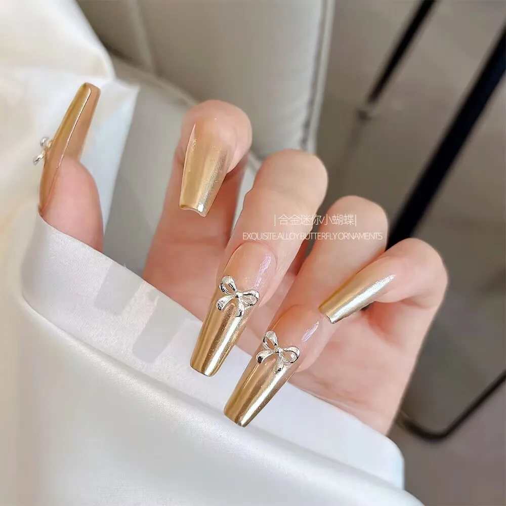 20 stuks Mini Strik Vlinder Goud Zilver Kleuren Eenvoudige Legering Nail Art Decoraties Manicure Onderdelen Levert Charme
