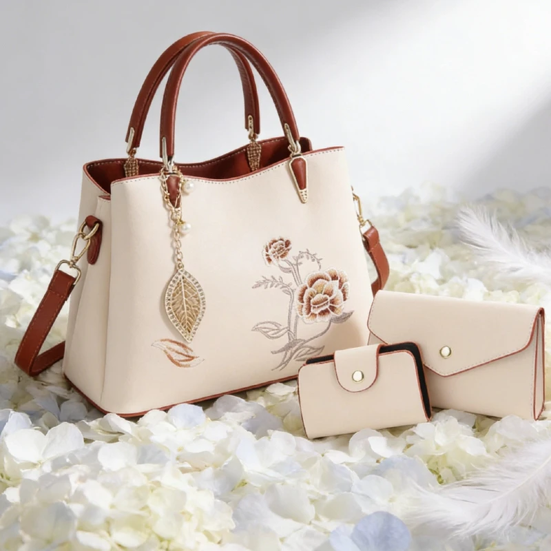 Three-piece set of women's handbag covers, including a large-capacity crossbody bag embroidered with carnations, perfect for bir