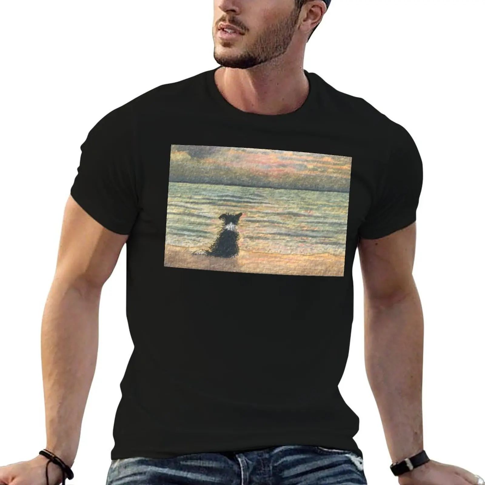 A Border collie dog gazes out over the ocean watching the sun come up, greeting the morning T-Shirt