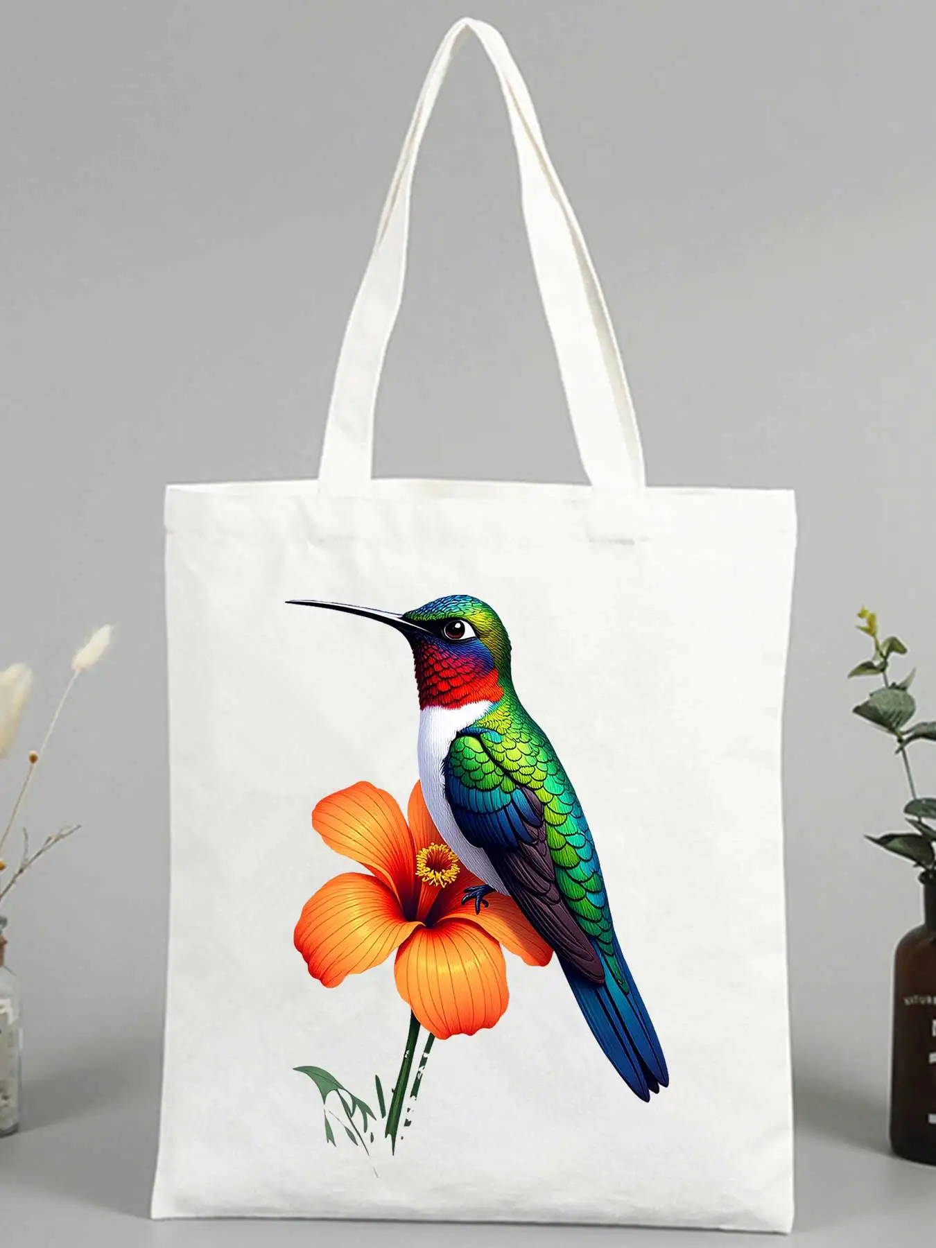 Women's hummingbird and hibiscus canvas tote bag, ideal for casual outings and summer shopping