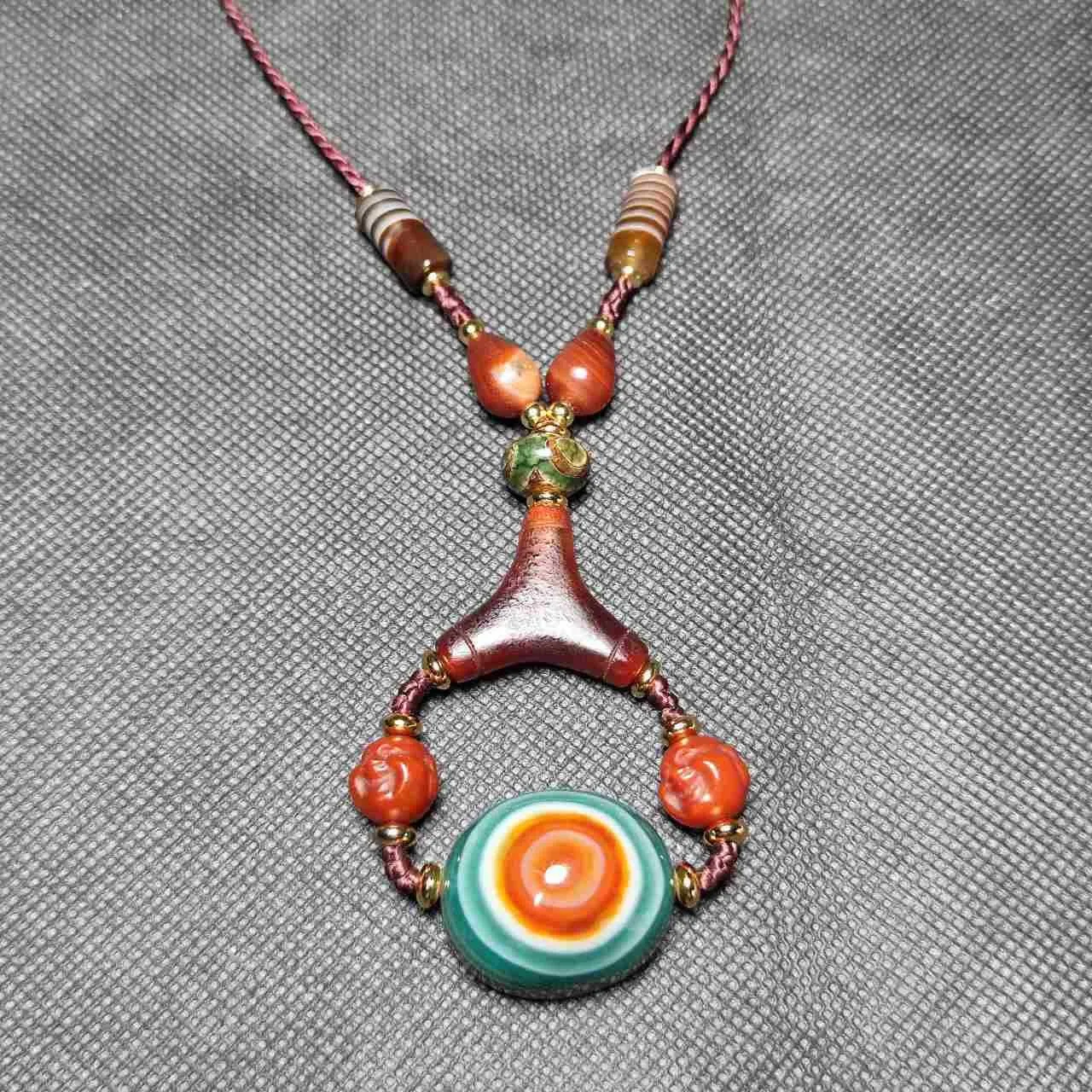 

Tibetan jewelry: Natural Agate Sheep plate eye, Sky eye Tianzhu Dzi with Maitreya Buddha head Wen play Adjustable Necklace