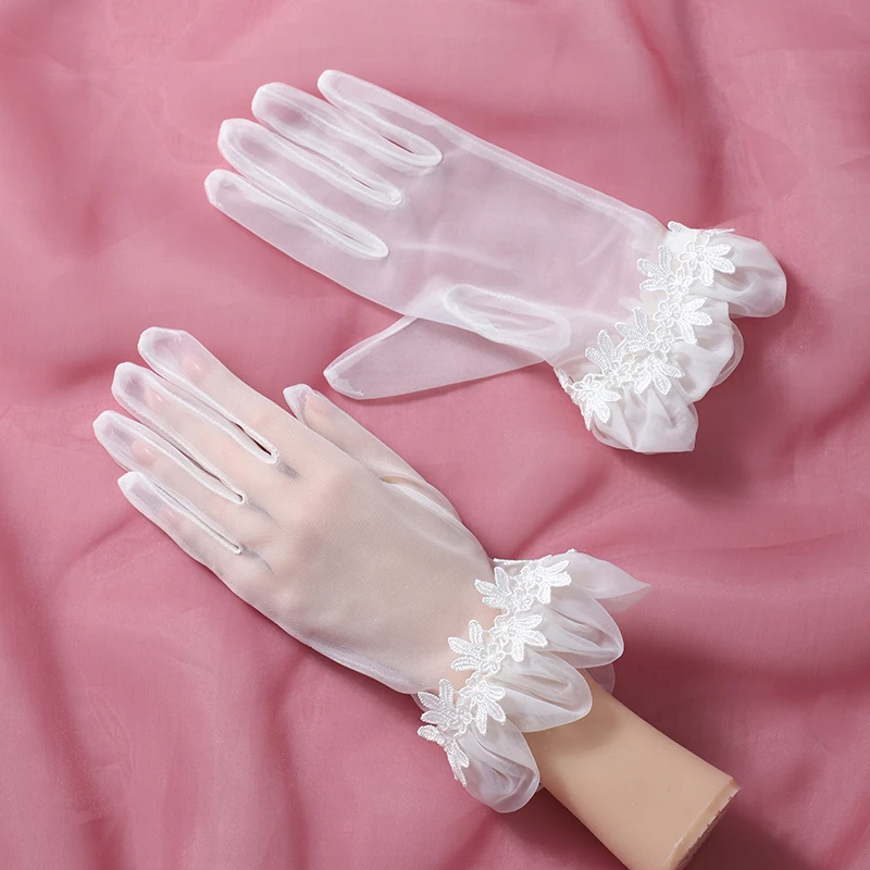 The bride's accessory is a pair of white gloves suitable for women's wedding parties