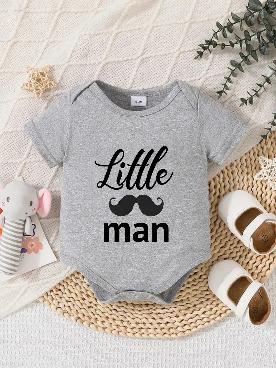 Playful letter-printed baby short-sleeve triangle bodysuit. Button closure for easy dressing, machine washable