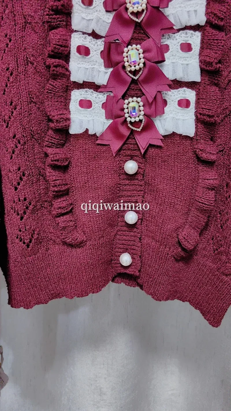 Primavera e autunno nuove ragazze dolci cardigan corto lavorato a maglia miniera cravatta fiocco in pizzo scavato girocollo maglione con fibbia di perle