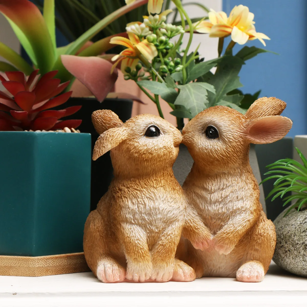 

Two rabbits kissing each other, rabbits in the garden, balcony, flower pots, decorative ornaments, accessories, Easter rabbits