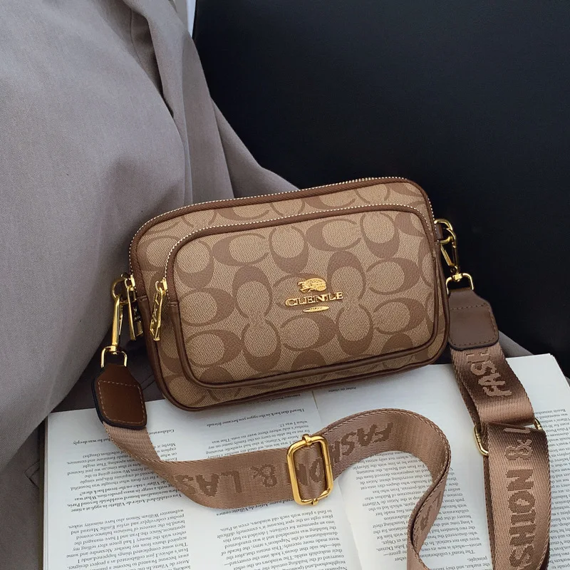 Original Circular-Pattern Logo Crossbody: Retro-luxury, durable fabric, adjustable strap. Ideal for daily/work/social use