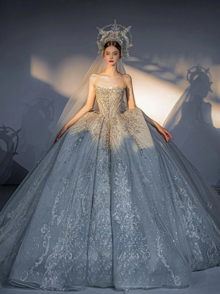 

A new strapless heavy-duty luxurious dress with a textured main fabric and a large tail