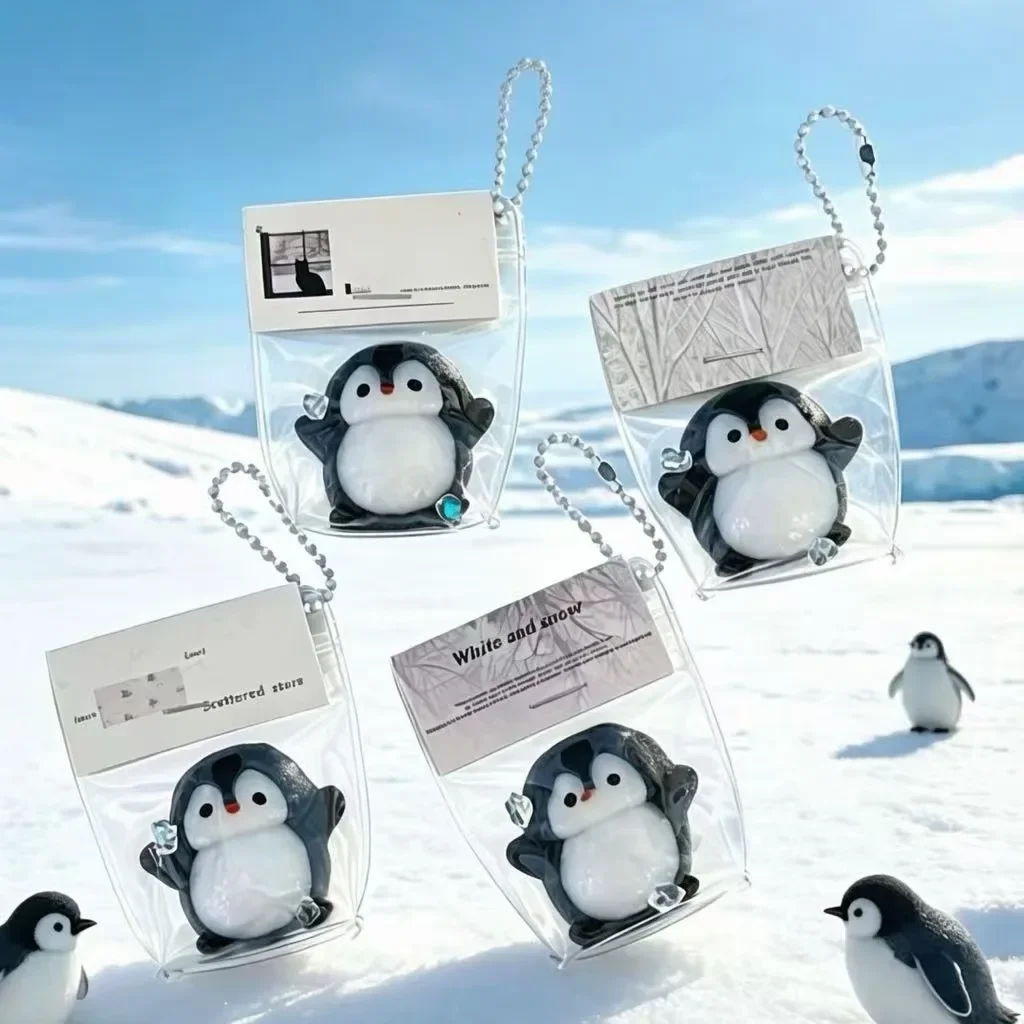 The new penguin pinch music doll small pendant girl backpack keychain mini pinch slow rebound decompression toy