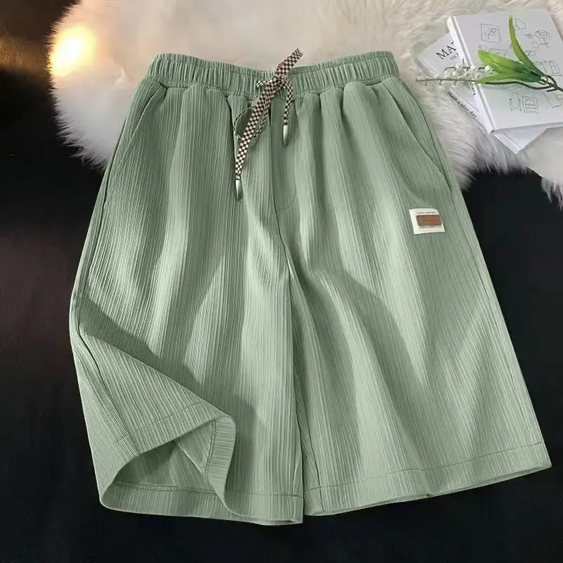 

Модные однотонные повседневные шорты со сращенными карманами, женская одежда, новинка лета 2025 года, свободные универсальные эластичные шорты с высокой талией