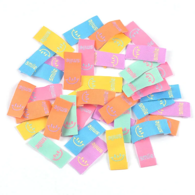 50Pcs Colorful Smile Embroidery Colth Labels Garment Washable Care Tags Sewing Accessories Crafts DIY Knitting Bag Shoe Supplies