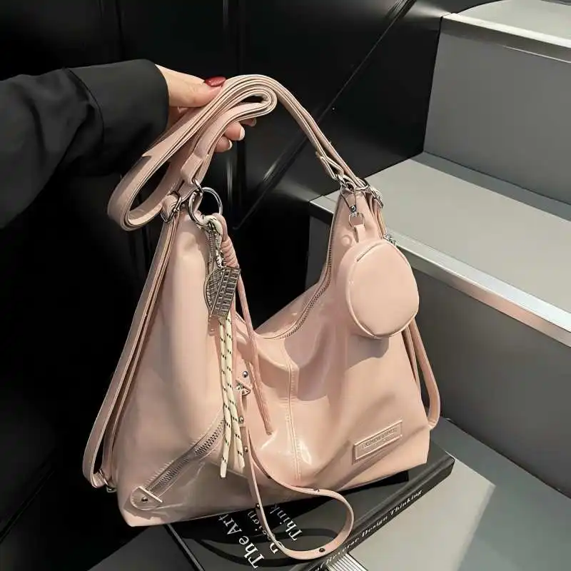 

SS24's Roomiest Tote. A uniquely designed carry-all handbag blending sophisticated style with everyday functionality.