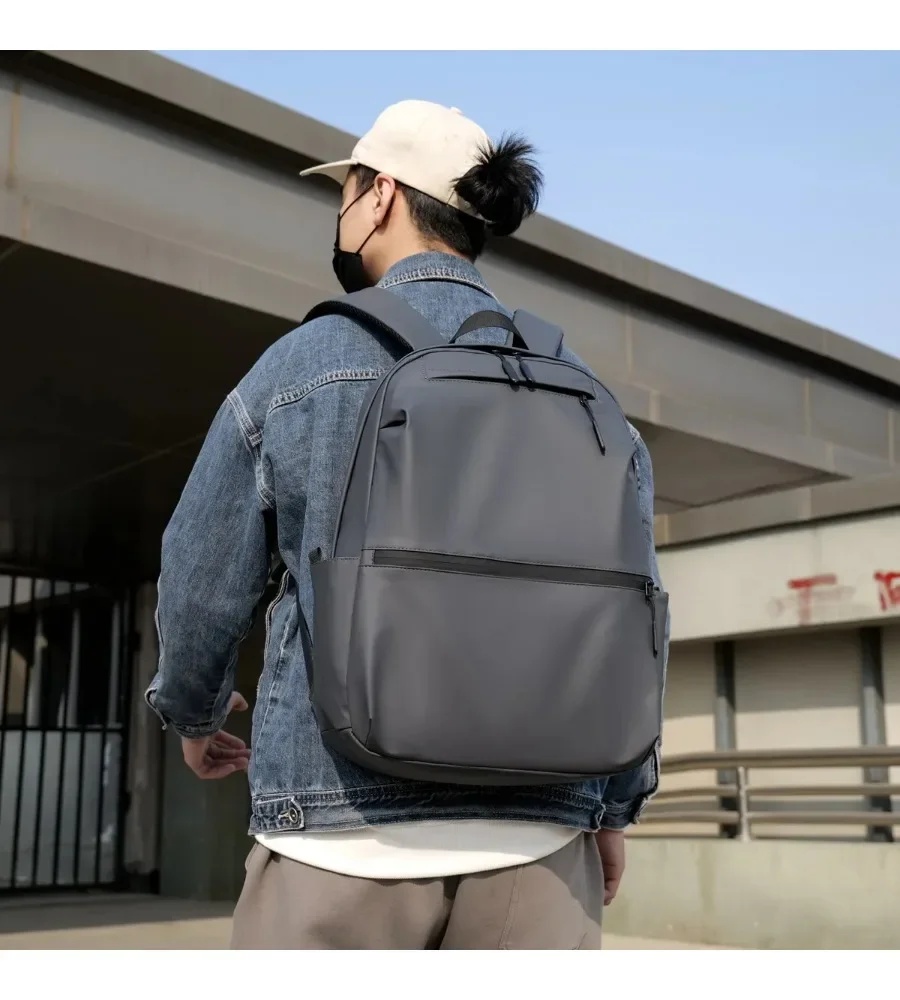 Dirt resistant fabric and luggage strap make this student backpack practical for school and travel