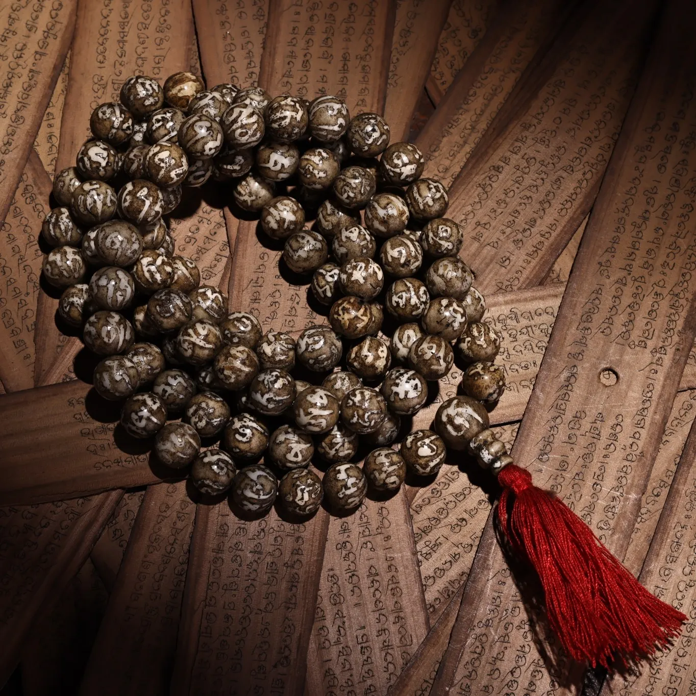 

Tibet, China hand carved a six-character mantra bead.