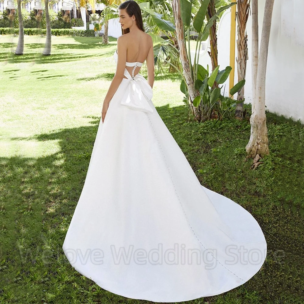 Classic Open Back Sweetheart Wedding Dress Strapless Sleeveless A-Line Floor Length with Bow and Buttons Bridal Pocket Gowns