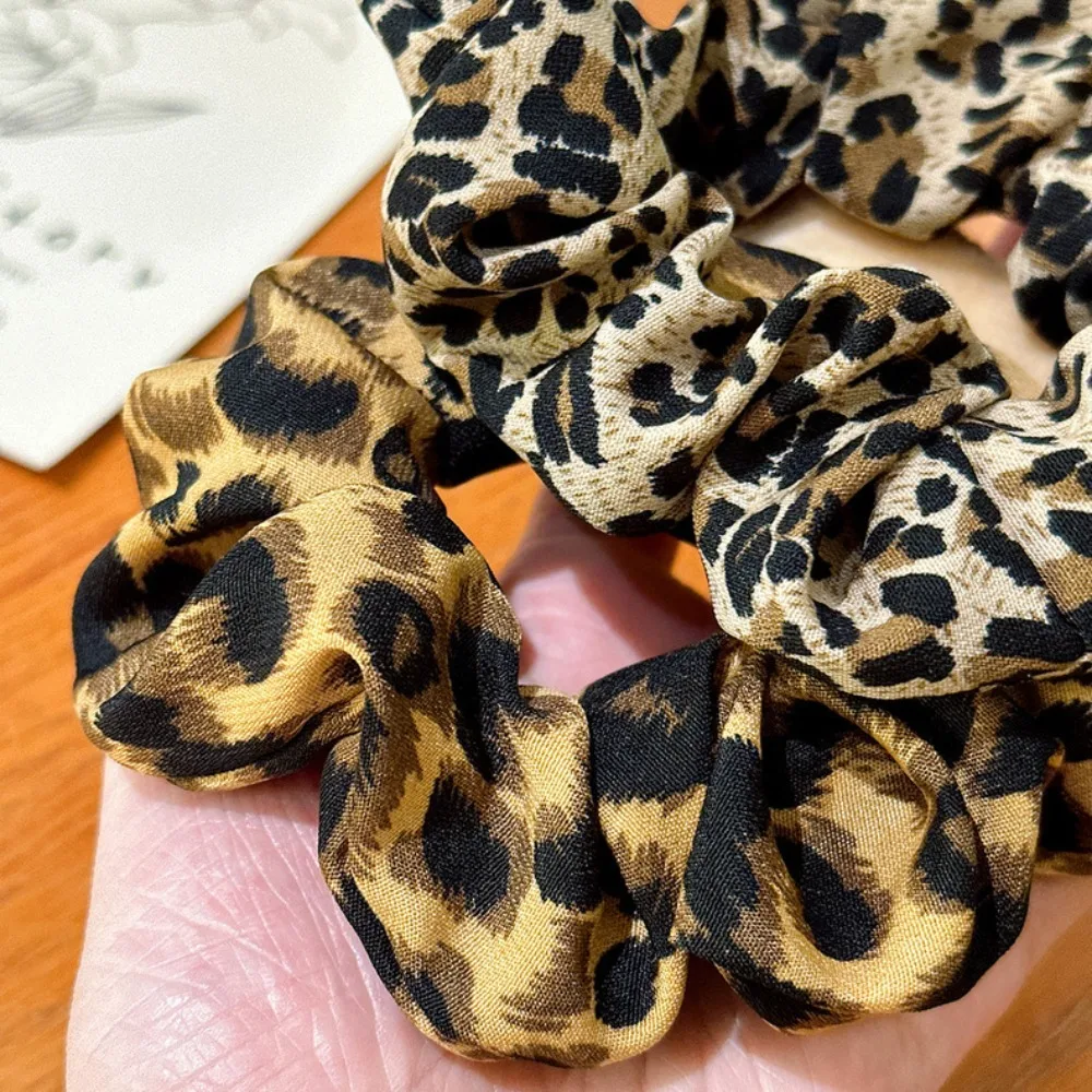 Sanrio Hello Kitty estampado de leopardo pinzas para el cabello y lazos para el cabello de bebé Otoño/Invierno pinzas para el cabello de moda para niña regalos de vacaciones