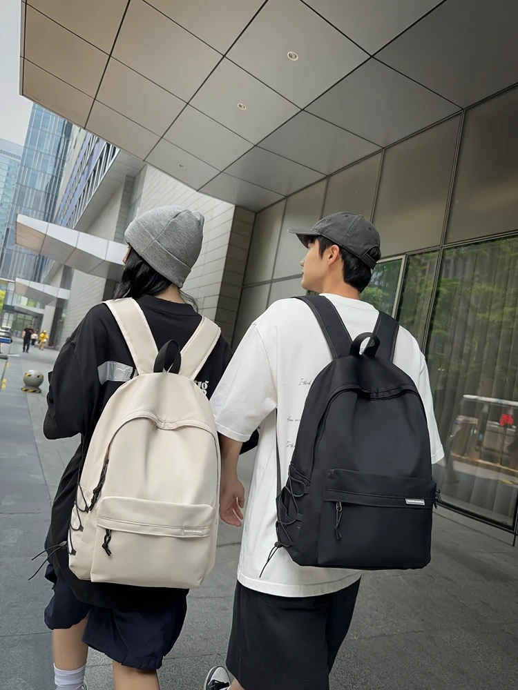 

Multifunctional backpack men's fashion backpack simple solid color student bag large capacity short-distance travel bag.