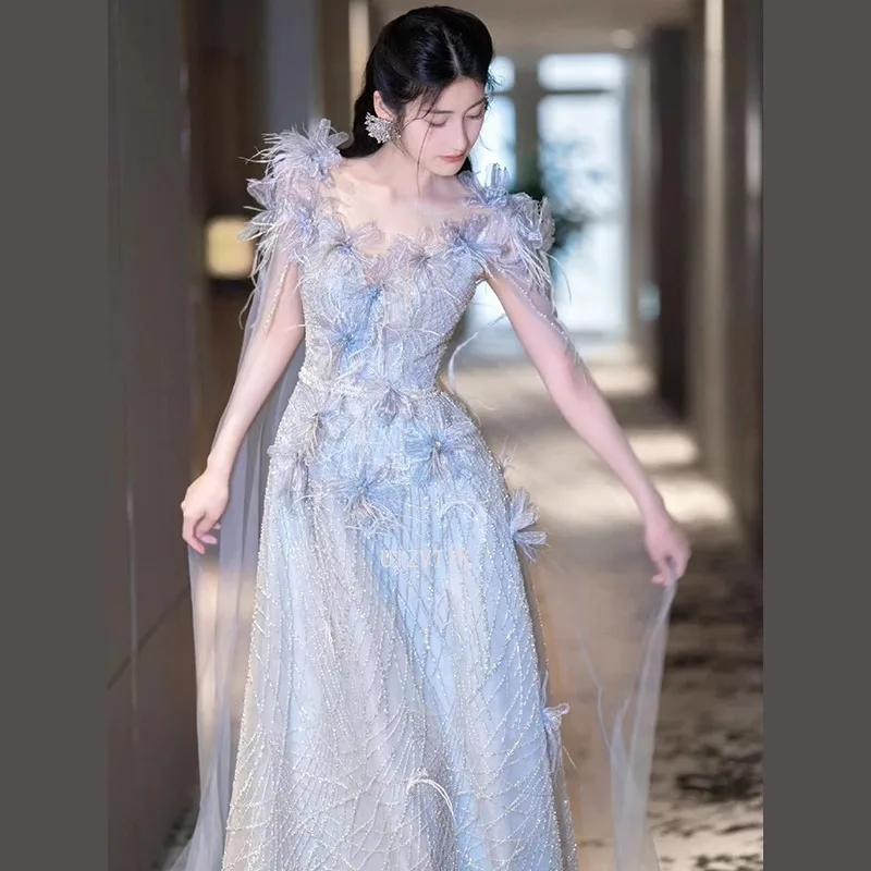 فساتين نسائية زرقاء طويلة لحفلات الزفاف أنيقة مزينة برقبة على شكل حرف v بدون أكمام من التل فستان سهرة فستان حفلات