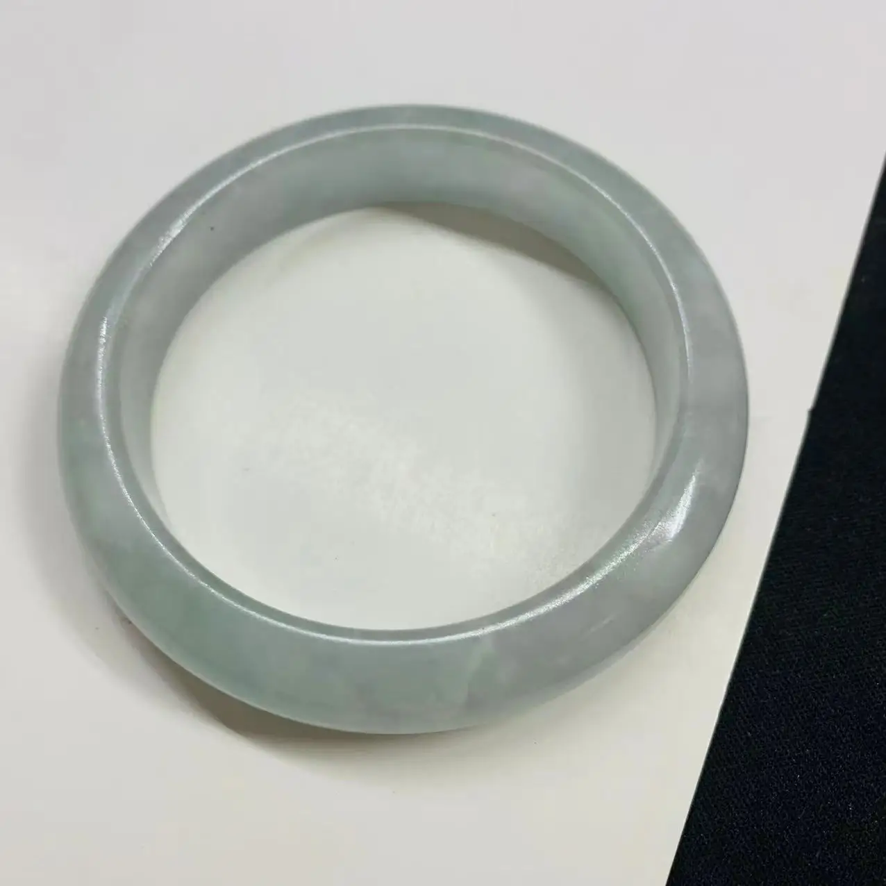 

58.7mm natural jadeite light colored jade bracelet photographed in real life