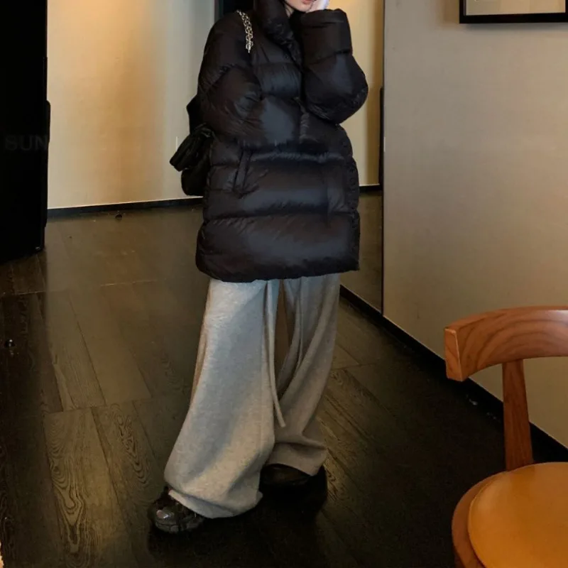 Black Medium To Long Cotton Jacket for Women in Winter 2025 Fashionable New Style Loose and Thick Stand Up Collar Parkas