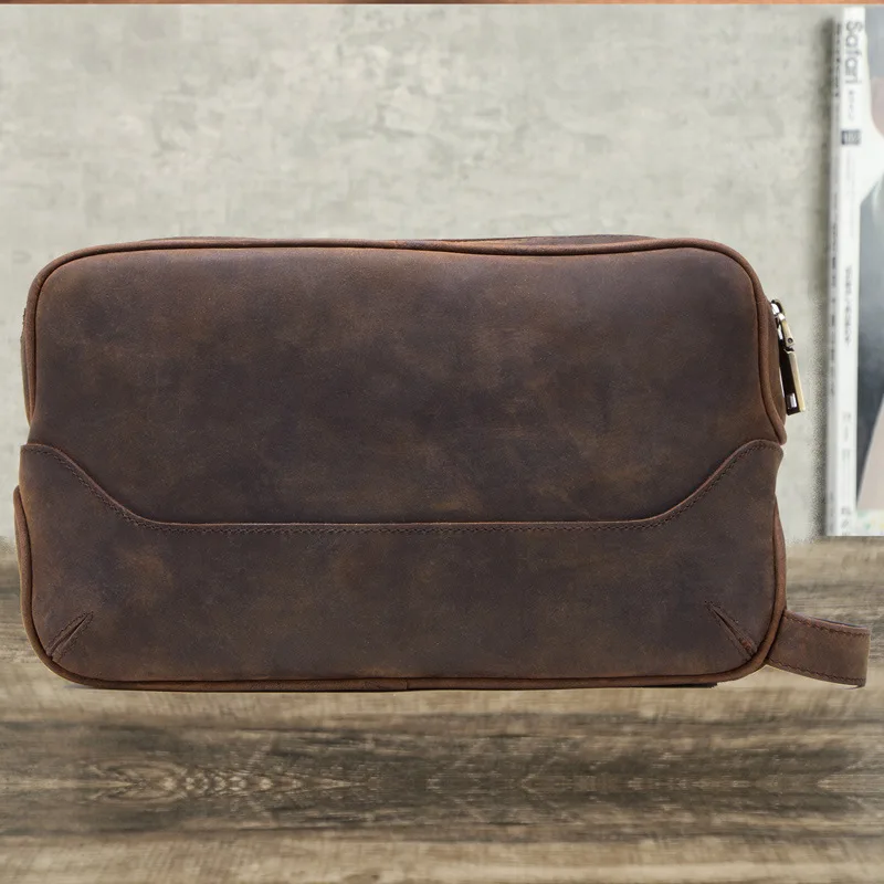Men's and women's genuine leather hand-held travel toiletries and makeup bags with large storage capacity and double zippers