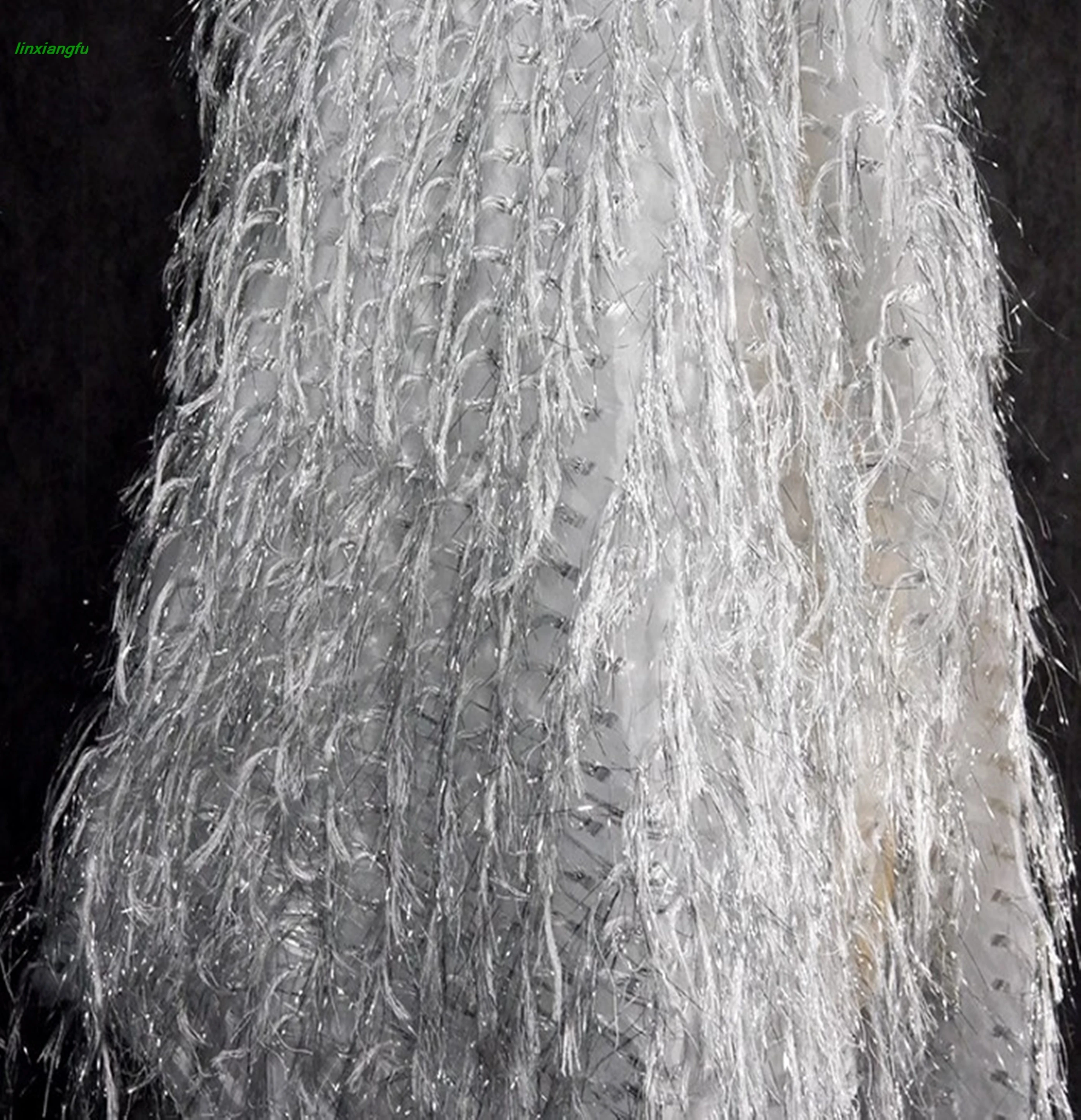 

High end yarn bottom tassel silver fabric, hand cut jacquard fabric for dresses, creative designer fabrics for formal fashion.