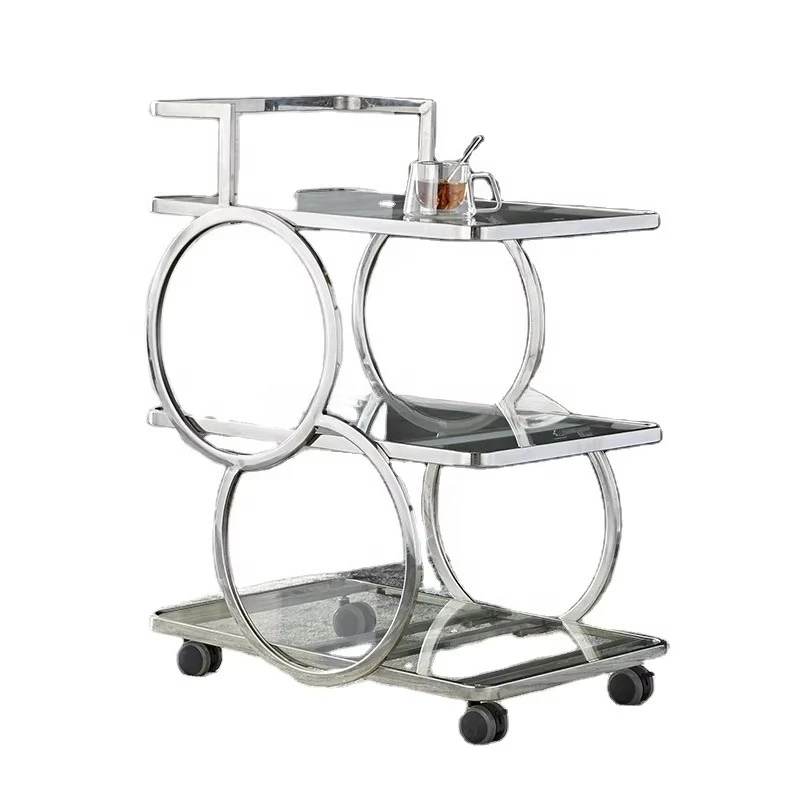 

Барная тележка для вина с серебряной рамой и уникальной стеклянной столешницей для использования в отелях и ресторанах.