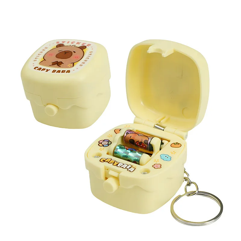 Mini macchina per adesivi creativi scatola a sorpresa giocattoli di decompressione portachiavi divertente macchina per adesivi rotanti ciondolo per zainetto regalo per ragazza