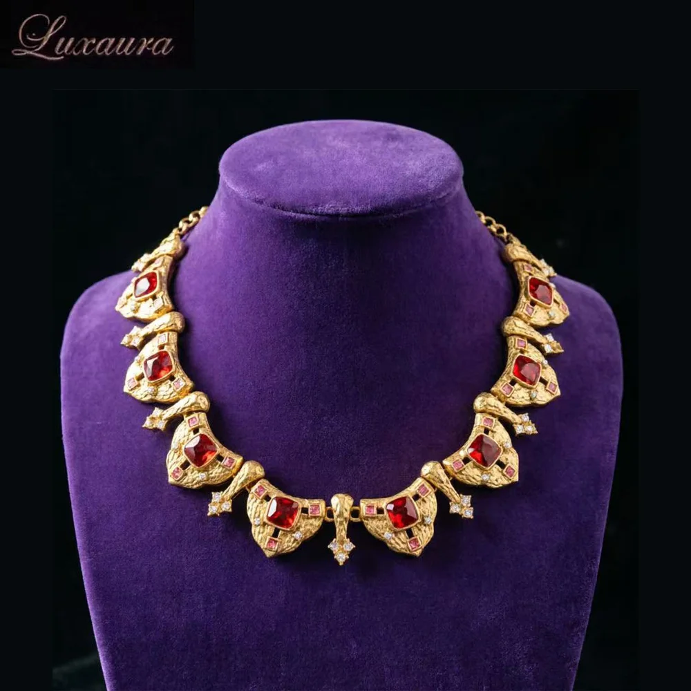 

Vintage jewelry featuring a fashionable and classic gold geometric necklace design paired with Bohemian style women's necklace