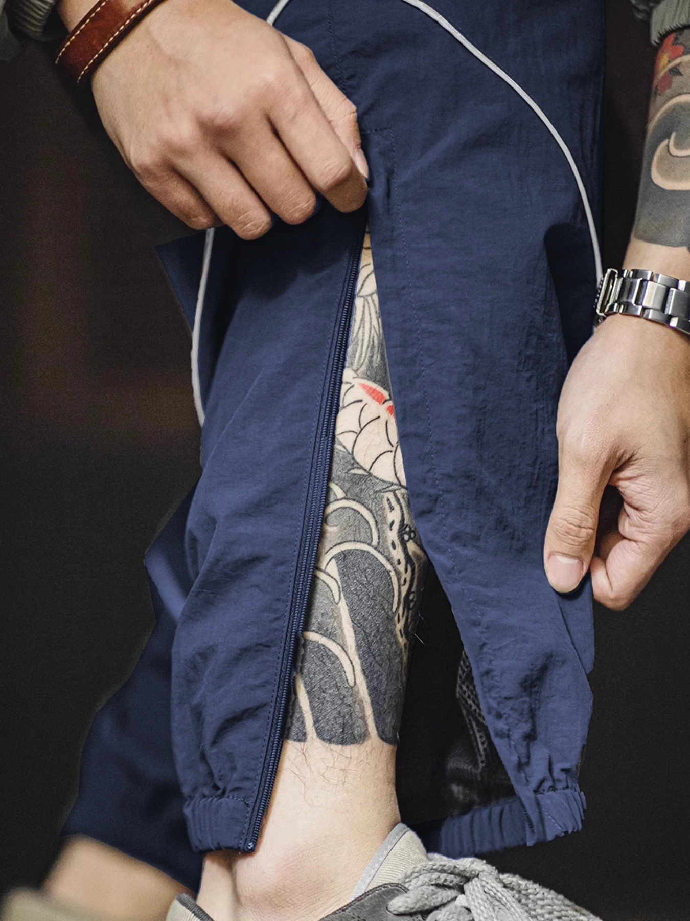 Lässiger Herren-Sportanzug für Herbst und Winter, reflektierende, schnell trocknende, lockere Jacke und lange Hose, 100 % Nylon