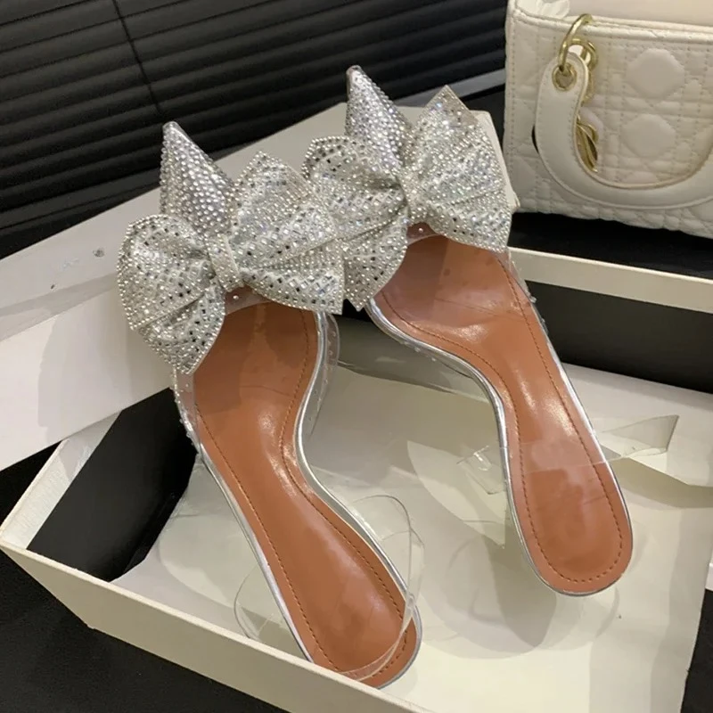 

Aneikeh Fashion Design Crystal Bowknot Women Pumps Sexy Pointed Toe Clear Low Heels Wedding Prom Shoes PVC Transparent Sandals