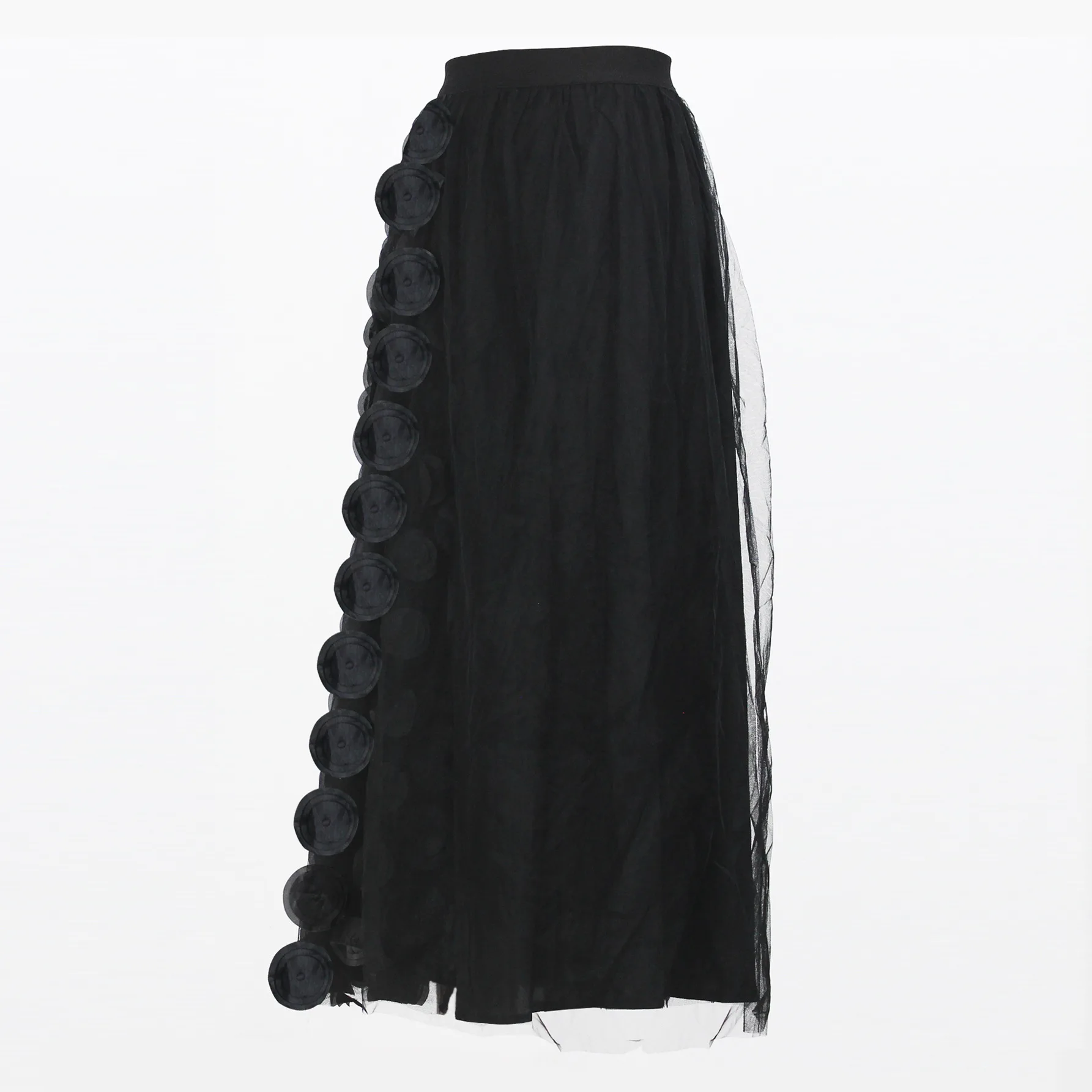 Long solid-color midi skirt with three-dimensional decorative patches and spliced mesh fabric