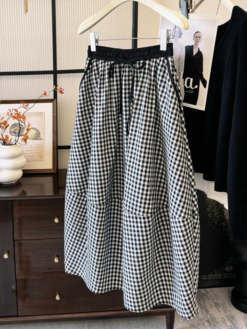 

This year's popular Korean style dress is a light and mature retro plaid half skirt with cotton and linen casual A-line skirt
