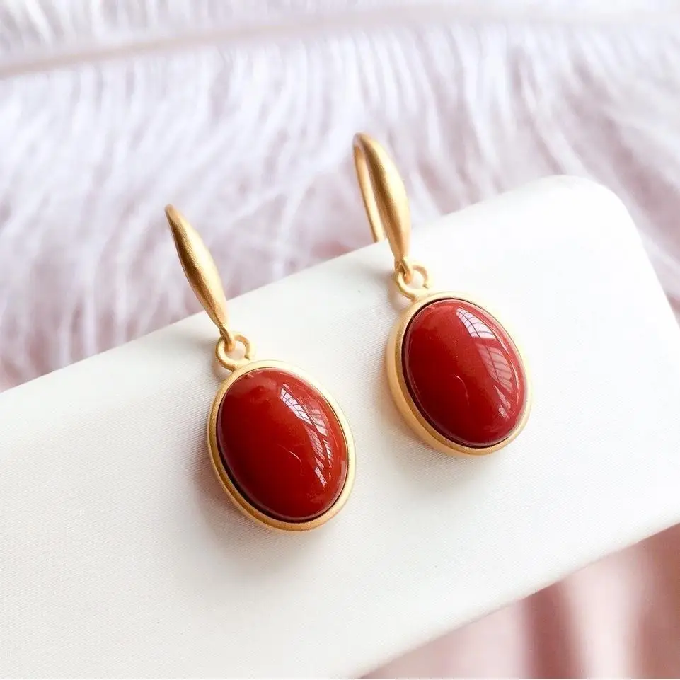 

Stylish and elegant ancient gold inlaid red jade women's simple geometric earrings