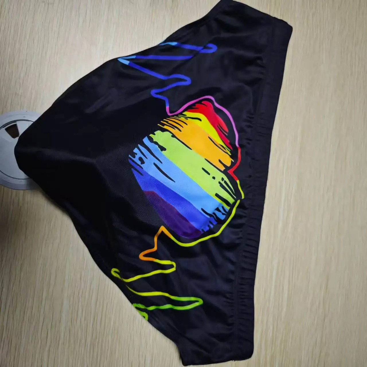 Wholesale foreign trade men's simple rainbow triangle swimming trunks with cup sports low waist quick-drying triangleUXH367-1