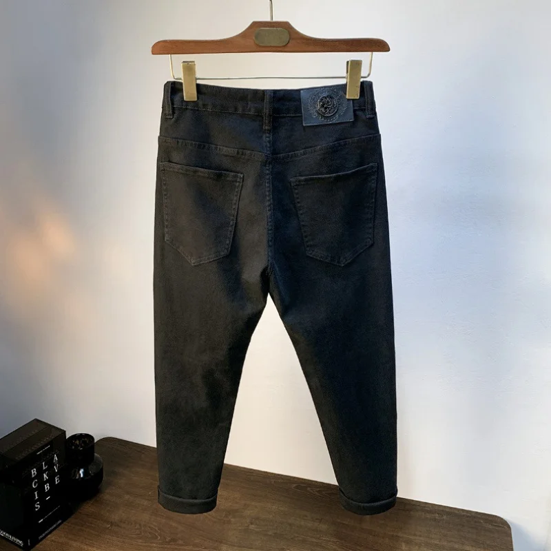 Jeans neri puri da uomo estivi sottili elasticizzati da uomo Slim Fit piedi stretti pantaloni a matita pantaloni lunghi moda Casual Business