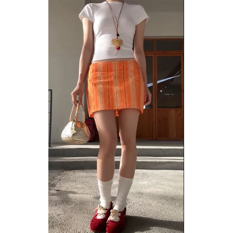 

Американская повседневная женская юбка А-силуэта с низкой талией, оранжевыми полосками и ярким принтом, стройнящая фигуру