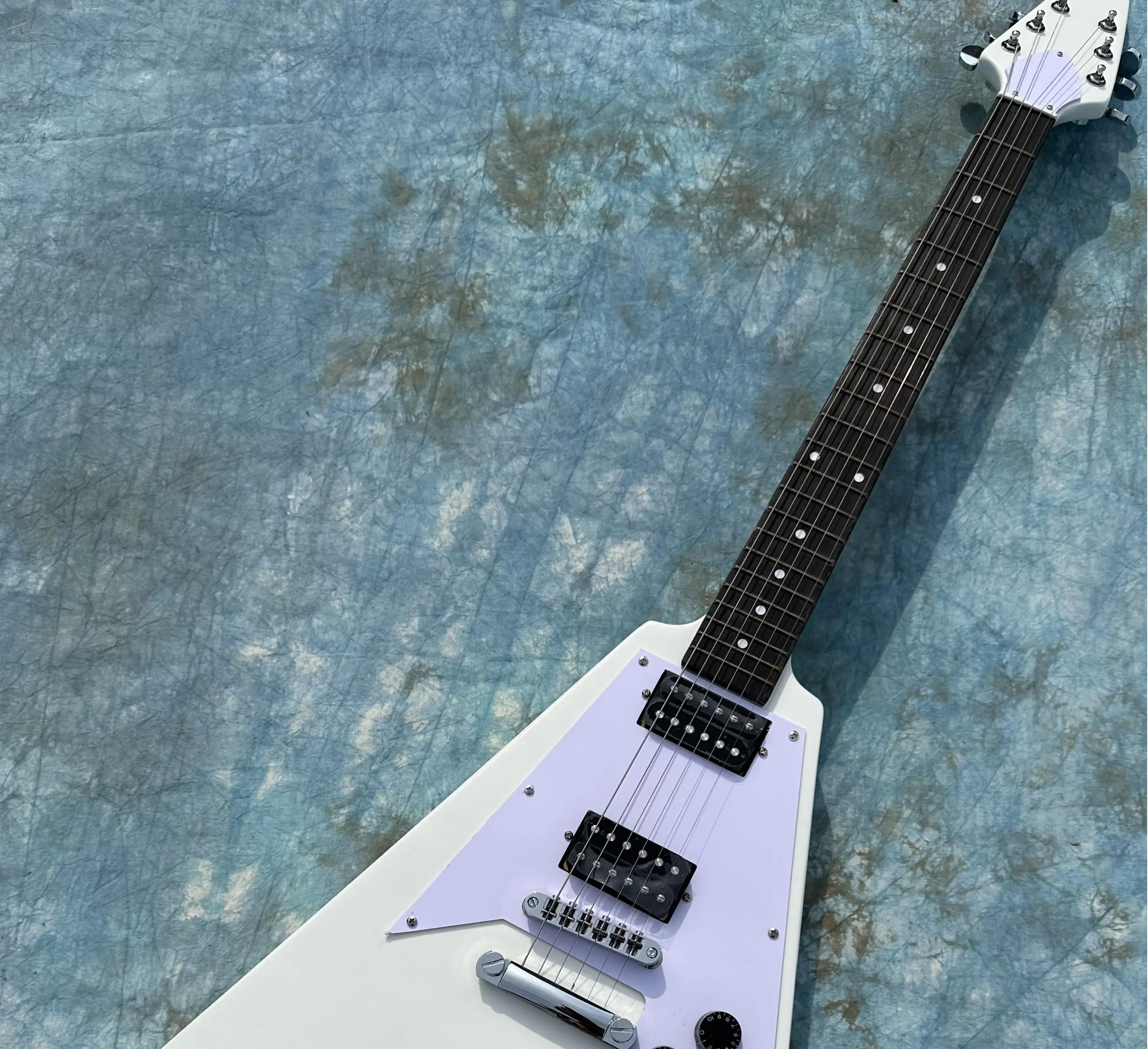 Irregular electric guitar, white flying V, black open pickup, imported wood and paint, shiny, in stock, fast shipping